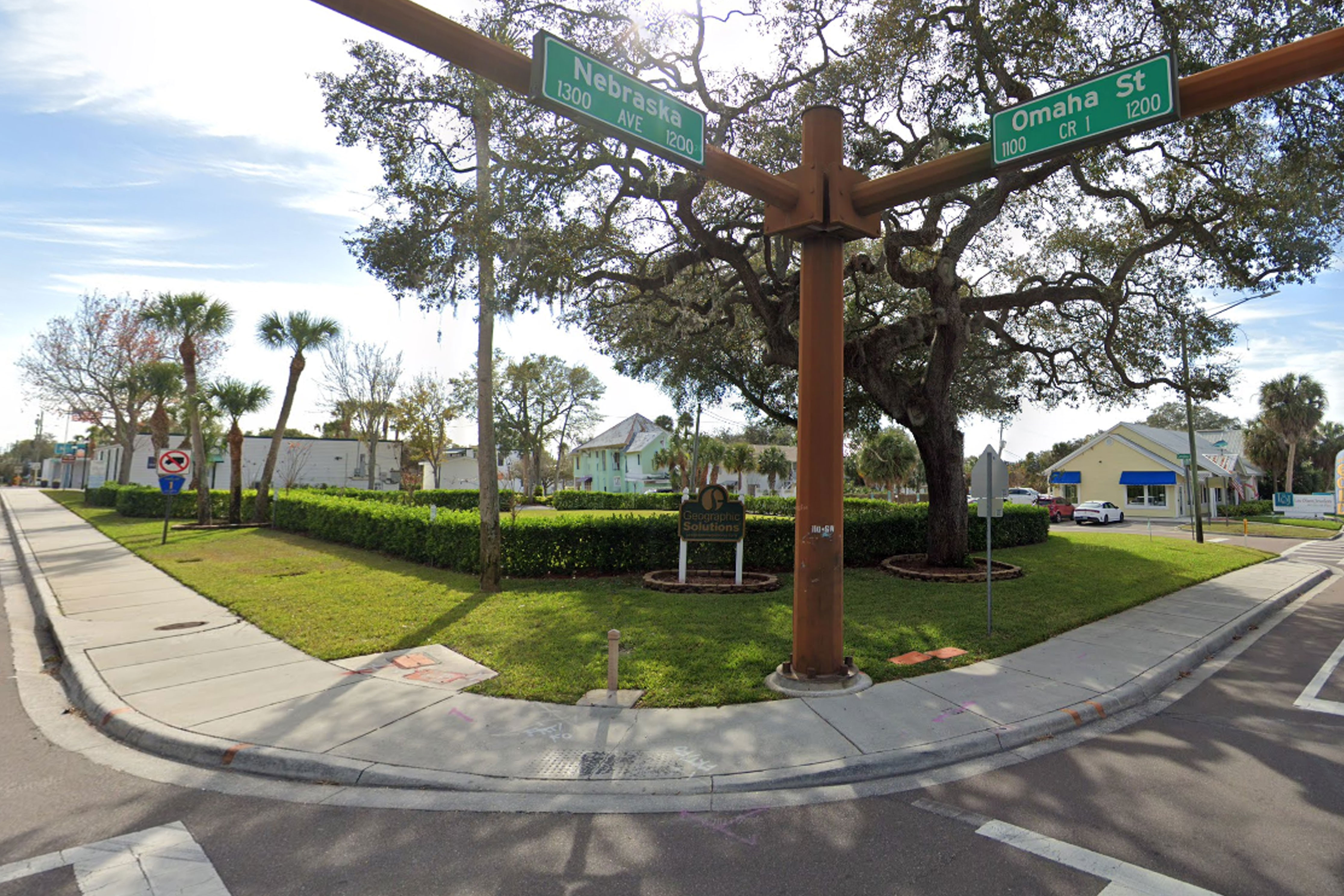 This image is an exterior photograph of green space located at 1188 Omaha Circle, Palm Harbor Florida